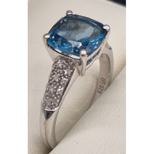 34 - 9ct white gold, blue topaz and diamond stone ring. 4.10grams. Ring size P.