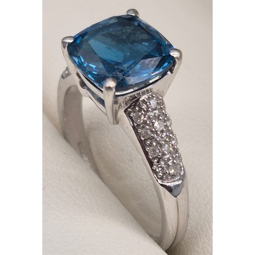 34 - 9ct white gold, blue topaz and diamond stone ring. 4.10grams. Ring size P.