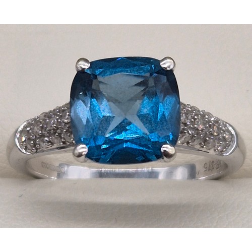 34 - 9ct white gold, blue topaz and diamond stone ring. 4.10grams. Ring size P.