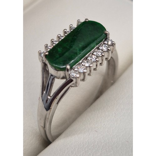 26 - 18ct white gold, Green Stone and diamond stone ring. 4.57grams. Ring size P 1/2.