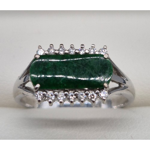 26 - 18ct white gold, Green Stone and diamond stone ring. 4.57grams. Ring size P 1/2.