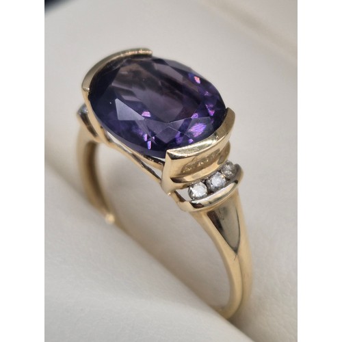 30 - 9ct yellow gold, Amethyst and diamond stone ring. 2.57Grams. Ring size P.