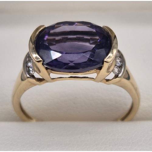 30 - 9ct yellow gold, Amethyst and diamond stone ring. 2.57Grams. Ring size P.