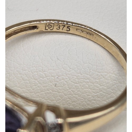 30 - 9ct yellow gold, Amethyst and diamond stone ring. 2.57Grams. Ring size P.