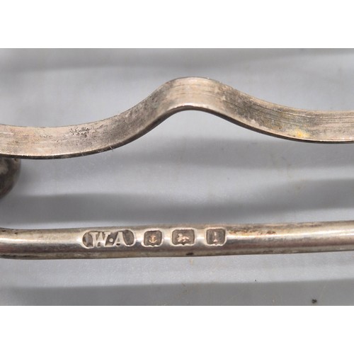 20 - Two Silver Marked Items; Birmingham silver heart shaped four slice toast rack and Weighted London Si... 