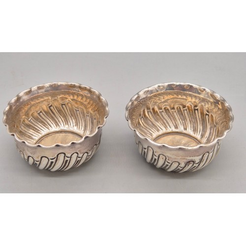 19 - A Collection of silver items; Pair of Sheffield silver art deco two handle condiment pots. Pair of S... 