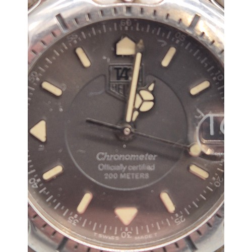 21 - Tag Heuer Chronometer wristwatch. No. 13274. WH5212. Working. Leather strap has wear.