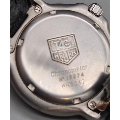 21 - Tag Heuer Chronometer wristwatch. No. 13274. WH5212. Working. Leather strap has wear.