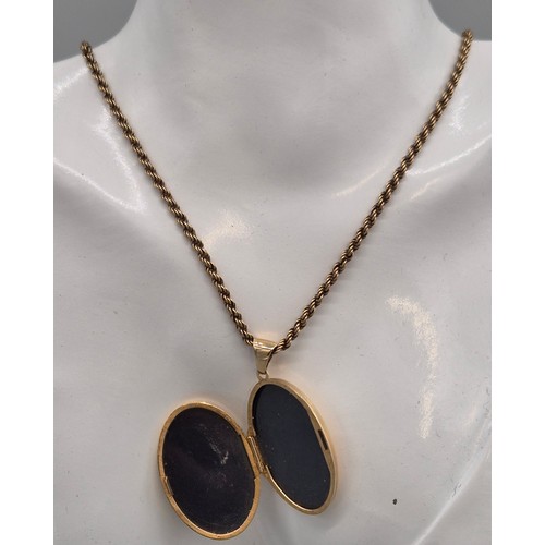 54 - 9ct yellow gold locket pendant, together with a 9ct yellow gold rope chain. Weight includes plastic ... 