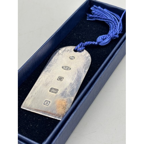 46 - A Sheffield silver bookmark by Francis Howard Ltd. Together with a boxed Sheffield silver serving sp... 