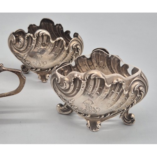 12 - A Collection of silver condiment pots and cruets. Pair of ornate French condiment pots- one glass in... 