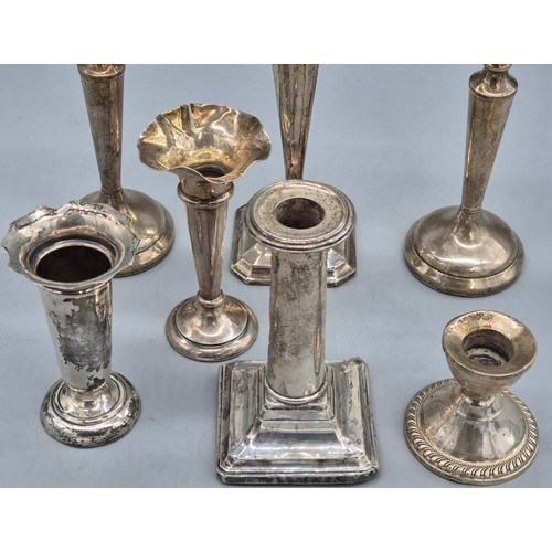 13 - A Collection of weighted silver candle sticks and bud vases; Includes Pair of Birmingham silver cand... 
