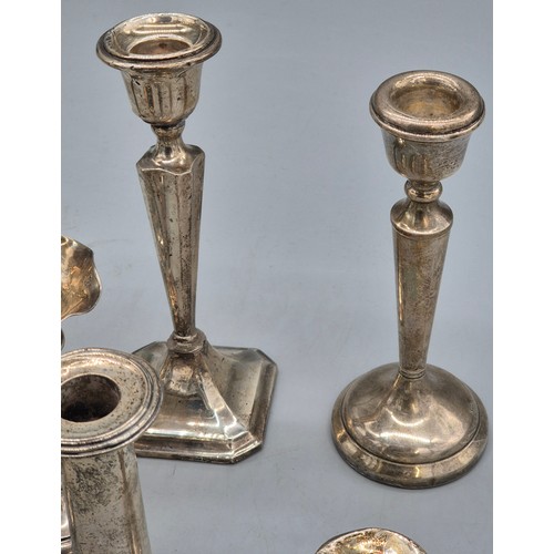13 - A Collection of weighted silver candle sticks and bud vases; Includes Pair of Birmingham silver cand... 