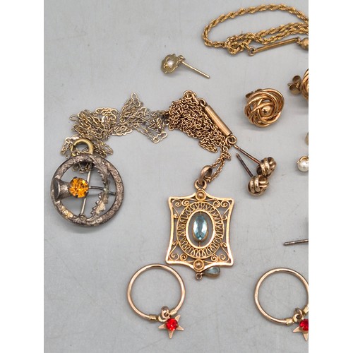 21 - A Small tub of 9ct gold, gilt metal and silver items of jewellery. Two Edwardian period pendants. 9c... 