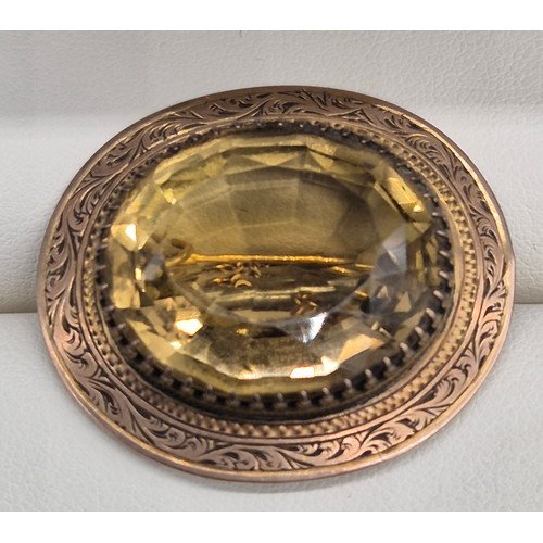 32 - Victorian gold brooch fitted with an oval form Citrine gem stone. 12grams.