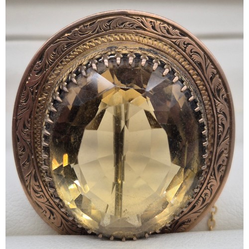 32 - Victorian gold brooch fitted with an oval form Citrine gem stone. 12grams.