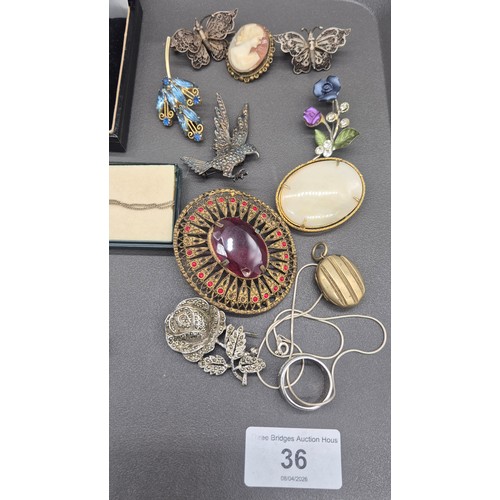 36 - A Collection of mixed jewellery; 925 silver Celtic design brooch, Silver McIntosh design jewellery, ... 