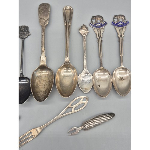 35 - A Collection of silver flatwares; Two London silver corn shaped corn forks, Georgian Birmingham silv... 