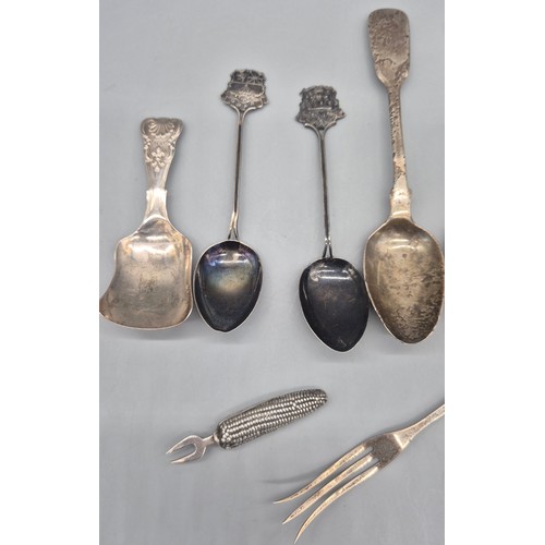 35 - A Collection of silver flatwares; Two London silver corn shaped corn forks, Georgian Birmingham silv... 