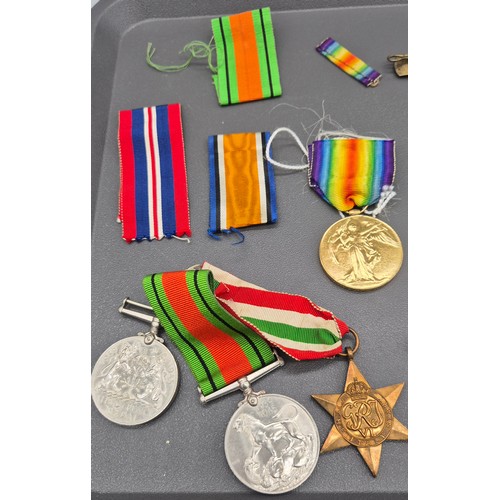 23 - A Selection of WWI & WW2 Medals, buttons and cap badges. Silver and enamel Scottish Rifle brooch. WW... 