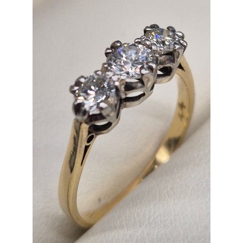 41 - 18ct yellow gold and diamond stone ring. 0.60cts. Three round cut brilliant diamonds. 2.20Grams. Rin... 