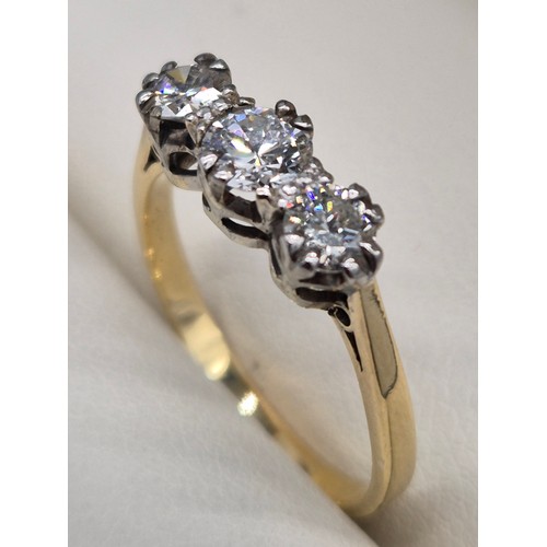 41 - 18ct yellow gold and diamond stone ring. 0.60cts. Three round cut brilliant diamonds. 2.20Grams. Rin... 