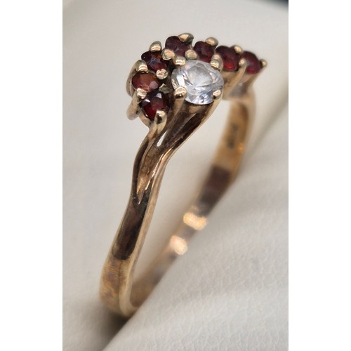 39 - 9ct yellow gold, garnet and CZ Stone ring. 2.77Grams. Ring size P.