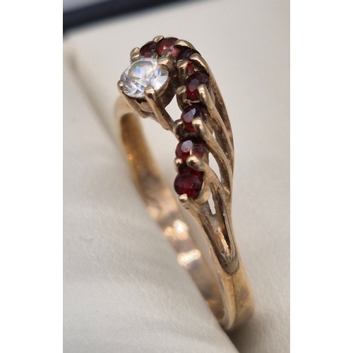 39 - 9ct yellow gold, garnet and CZ Stone ring. 2.77Grams. Ring size P.