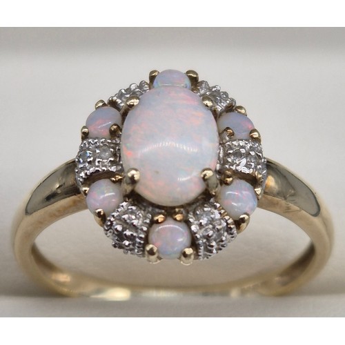 38 - 9ct yellow gold, Opal and diamond cluster ring. 2.90grams. Ring size T.
