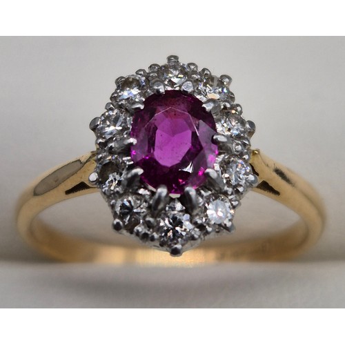 48 - 18ct & platinum, pink and diamond cluster ring. Oval form ruby/ pink sapphire, surrounded by round c... 