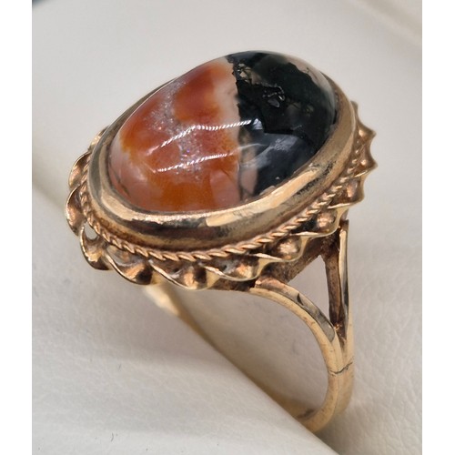 56 - 9ct yellow gold and moss agate stone ring. 3.48grams. Ring size N.