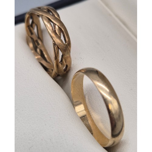 60 - Two 9ct yellow gold band rings; 9ct Celtic band ring-Ring size R. 9ct wedding band ring- ring size R... 