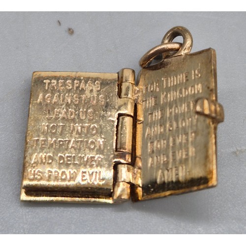 55 - A Collection of 9ct and 14ct yellow gold charms. One 14ct gold bell charm. The rest are 9ct gold- we... 