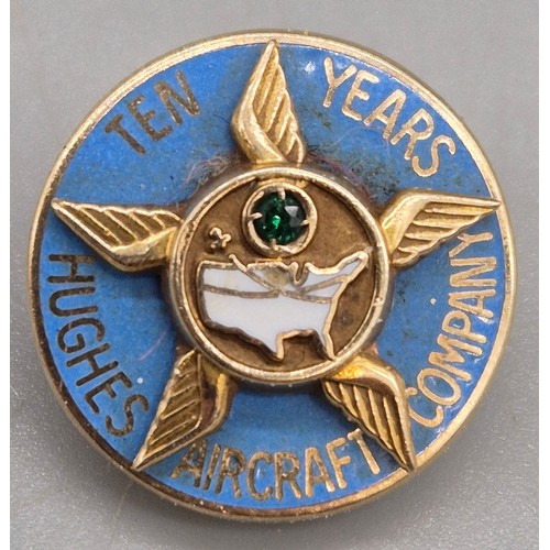 65 - Two 10ct yellow gold and enamel pins. 8.96grams. Aircraft company- ruby and emerald gem stones fitte... 