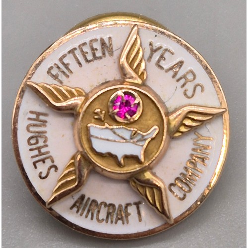 65 - Two 10ct yellow gold and enamel pins. 8.96grams. Aircraft company- ruby and emerald gem stones fitte... 