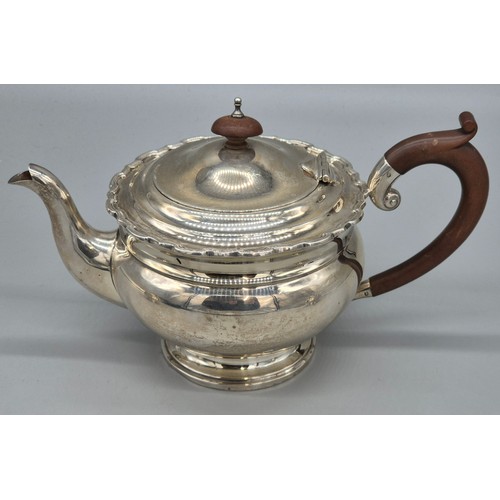 12 - Three piece Birmingham silver tea service. Tea pot, sugar and cream. Produced by Adie Brothers Ltd. ... 