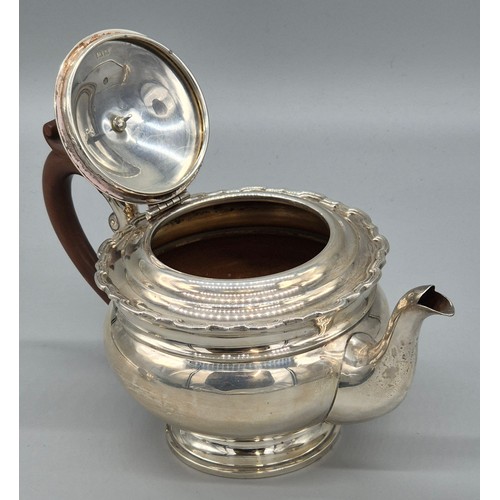 12 - Three piece Birmingham silver tea service. Tea pot, sugar and cream. Produced by Adie Brothers Ltd. ... 