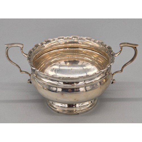 12 - Three piece Birmingham silver tea service. Tea pot, sugar and cream. Produced by Adie Brothers Ltd. ... 