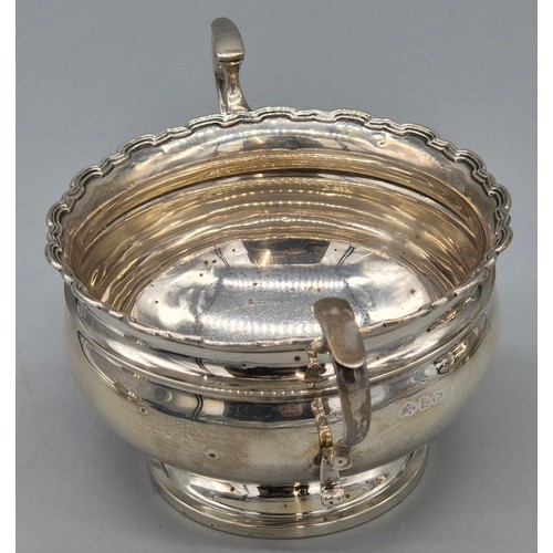 12 - Three piece Birmingham silver tea service. Tea pot, sugar and cream. Produced by Adie Brothers Ltd. ... 