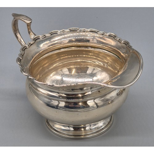 12 - Three piece Birmingham silver tea service. Tea pot, sugar and cream. Produced by Adie Brothers Ltd. ... 