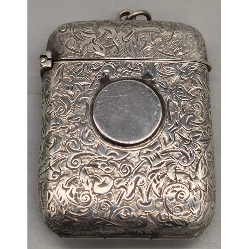 20 - A Collection of six Birmingham and one London Silver vesta cases. All ornately engraved and with som... 
