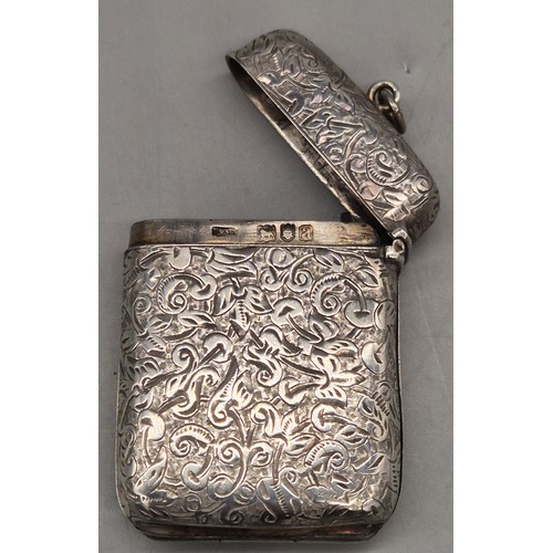 20 - A Collection of six Birmingham and one London Silver vesta cases. All ornately engraved and with som... 