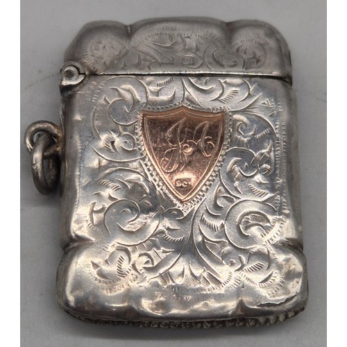 20 - A Collection of six Birmingham and one London Silver vesta cases. All ornately engraved and with som... 