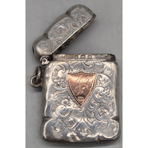 20 - A Collection of six Birmingham and one London Silver vesta cases. All ornately engraved and with som... 