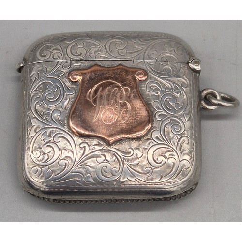 20 - A Collection of six Birmingham and one London Silver vesta cases. All ornately engraved and with som... 