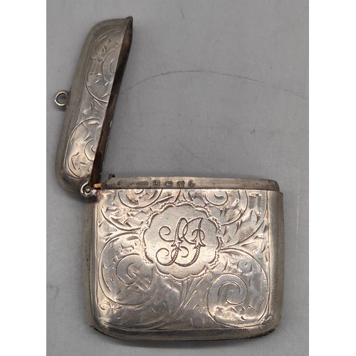 20 - A Collection of six Birmingham and one London Silver vesta cases. All ornately engraved and with som... 