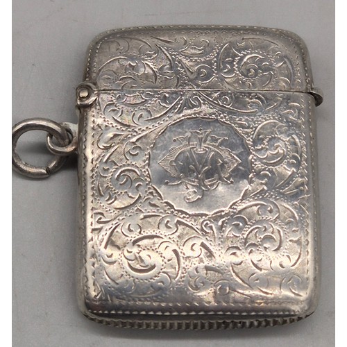 20 - A Collection of six Birmingham and one London Silver vesta cases. All ornately engraved and with som... 