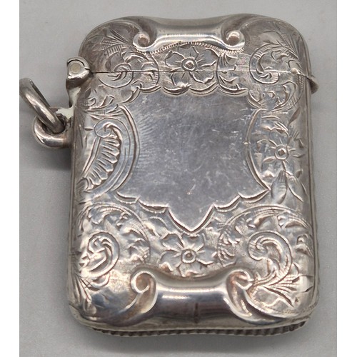 20 - A Collection of six Birmingham and one London Silver vesta cases. All ornately engraved and with som... 
