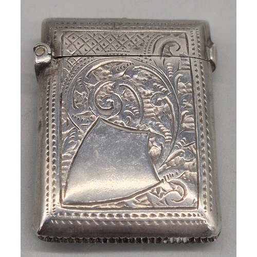 20 - A Collection of six Birmingham and one London Silver vesta cases. All ornately engraved and with som... 