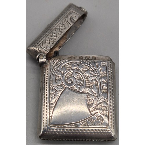 20 - A Collection of six Birmingham and one London Silver vesta cases. All ornately engraved and with som... 